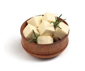 Bowl with cut tofu cheese and rosemary twigs isolated on white background