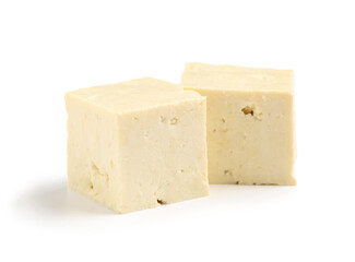 Pieces of tasty tofu cheese isolated on white background, closeup