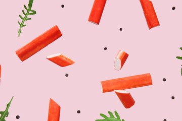 Tasty crab sticks with peppercorns and arugula leaves flying on pink background © Pixel-Shot