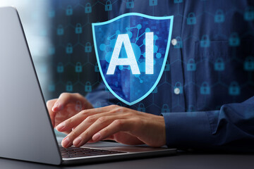 AI driven automated security response and threat detection. Artificial intelligence powered firewall and network defense. Man using laptop computer with machine learning based network security system.