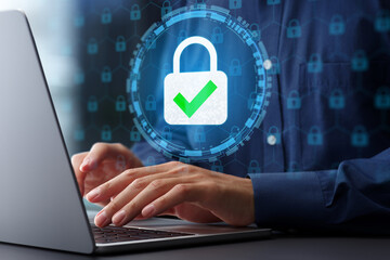 Secure data protection and network security systems. VPN connections and zero trust security. Man using laptop computer with an encrypted data security system.