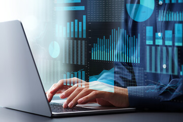Business management analysis using spreadsheet software. Financial graphs and table calculations. Businessman using laptop computer to analyze business conditions.