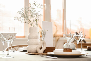 Table setting with flowers in restaurant, closeup