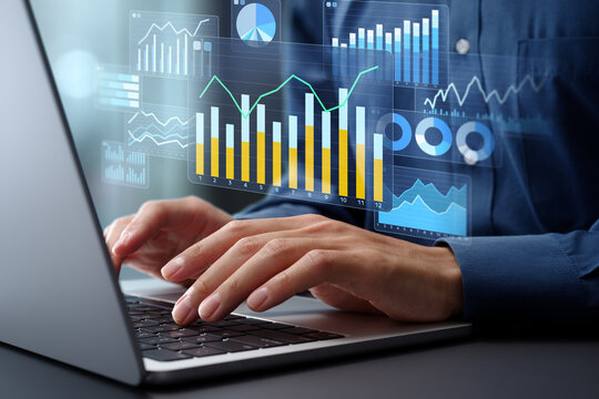 Data analysis dashboard and statistical marketing graphs. Analytics of web customer behavior and financial data. Analyst using laptop computer to analyze data.