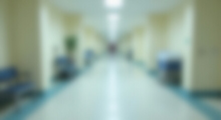 Blurry hospital hallway, person walking, medical equipment, waiting area, healthcare