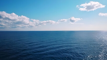 Fototapeta premium Vibrant Blue Ocean And Sky With White Clouds Under Sunny Day