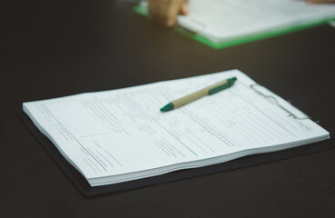 Obraz premium Contract document or application form and pen are placed on desk in business office, Contracting party.