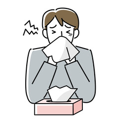 鼻をかむ男性の上半身