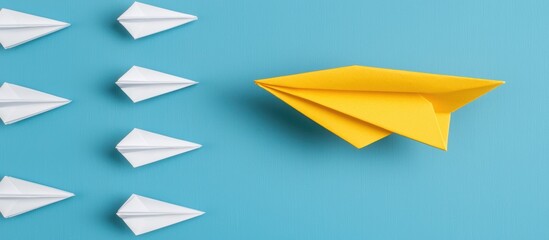 Yellow Paper Airplane Leading White Ones Against Blue Background Symbolizing Innovation and Creativity