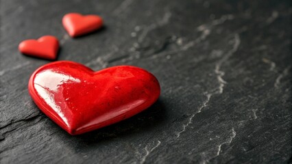 Fototapeta premium Red heart on dark background. Valentine's Day celebration concept. Copy space