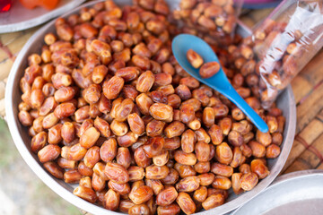 Date palm fruits are placed in trays ready for sale.
