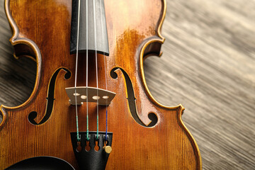 Violin and bow on white and black backgrounds with classical wooden details