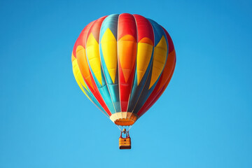 Fototapeta premium A colorful hot air balloon floating in the sky with a basket, representing adventure and travel