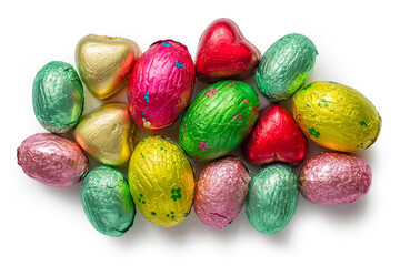 Set of chocolate candies in multi-colored foil on a white background. Multi-colored chocolate eggs.