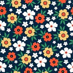 Seamless pattern with yellow, white and orange flower blossom garden on dark blue background. Cute hand drawn floral pattern for your fabric, summer background, wallpaper, textile.