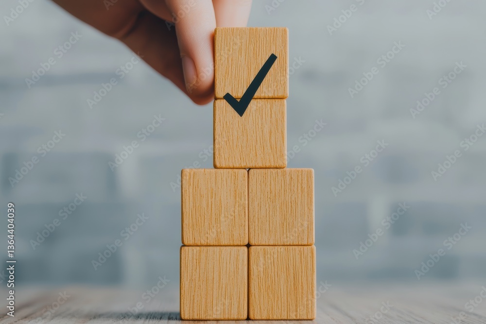 Aufkleber hand stacking wooden blocks with checkmark symbol representing success in a creative workspace