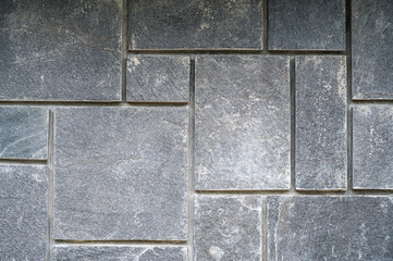 A pattern of grey paving street tiles.