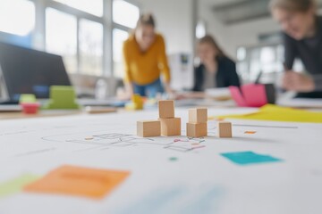 Wooden Blocks on Plans: Collaborative Business Strategy, Team Brainstorming, Office Space.