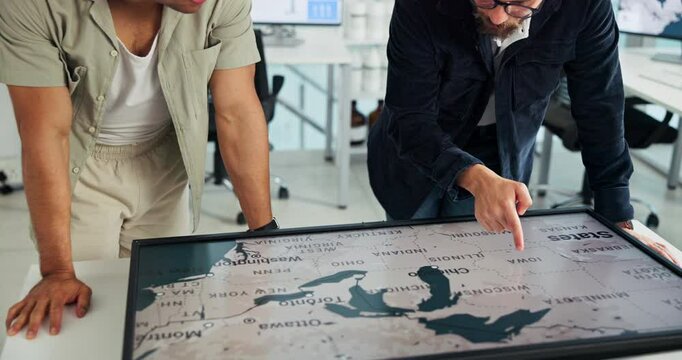 Business, men and interactive display with map in office of global selection, location and wind turbine project. People, worldwide screen and sustainable planning, windmill production and site choice