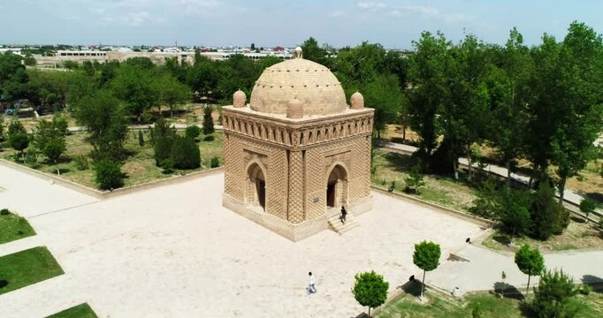 Drone flies around Ismoil Somoniy madrasah on a sunny day. Uzbekistan, Bukhara.