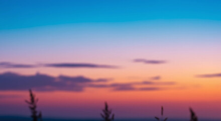 Colorful sunset sky with clouds and blurred foreground