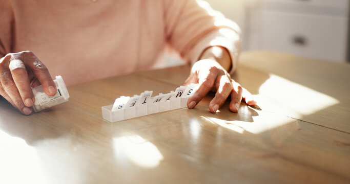 Elderly, hands and pills container in home for prescription medication, tablets dosage or health management. Senior person, medicine and capsule organzier for sorting drugs, daily routine or reminder