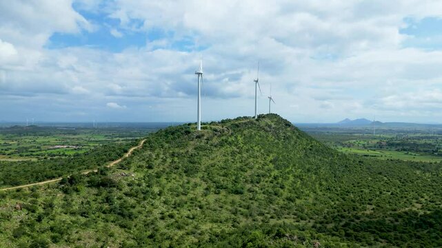 Wind turbine farm on a hill - Aerial Drone shot