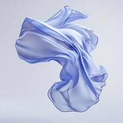 A flowing light blue fabric suspended in air against a plain white background in a studio shot