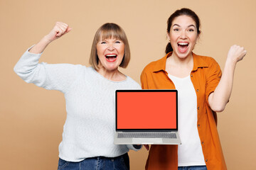 Elder winner parent mom 50s year old young adult daughter two IT women together wear casual clothes...