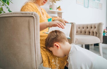 mother consoling her son during a study session at home, nurturing and supportive parenting, concept of mental health in education. Tyrant concept.