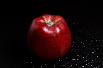 red apple with water drops