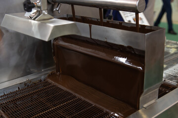 Chocolate pouring process in a confectionery factory during production