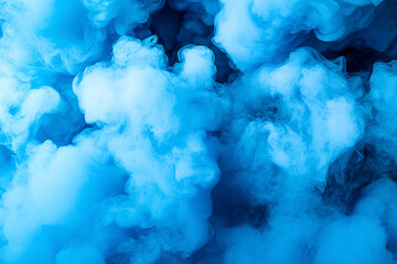 Fototapeta premium Swirling blue smoke fills the frame, creating a dynamic abstract background for creative projects