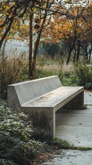 Industrial-style concrete bench in serene outdoor landscape