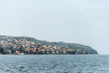 Fototapeta premium View of the Slovenian coastline from Koper, overlooking the Adriatic Sea and nearby coastal towns