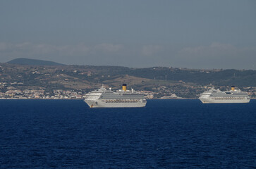 Mega family cruiseship cruise ship liners Favolosa and Fortuna anchored offshore of Civitavecchia...