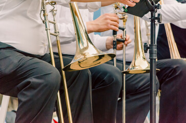 ands and trumpets of symphony orchestra musicians close up