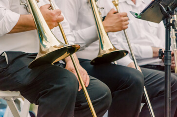 ands and trumpets of symphony orchestra musicians close up © Sofiia