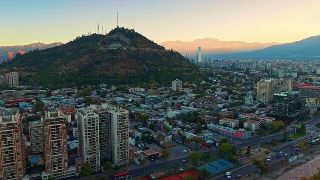 Aerial establisher sunrise skyline in Santiago de Chile capital city with San cristobal Hill landscape