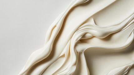 Close-up of a smooth, creamy texture. the texture appears to be made of a light-colored fabric or a similar material, with a smooth and smooth surface.