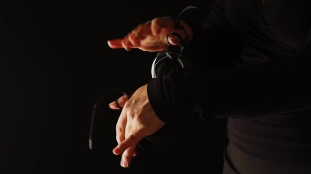 Close up of hands playing castanets in flamenco performance. Handheld