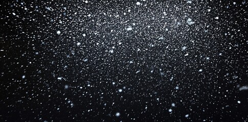 Obraz premium Falling Snowflakes Against Black Sky Creates Dramatic Winter Backdrop