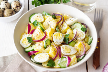 Salad with potatoes, cucumber, onion and eggs. Healthy food. Vegetarian food.