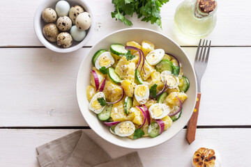 Salad with potatoes, cucumber, onion and eggs. Healthy food. Vegetarian food.