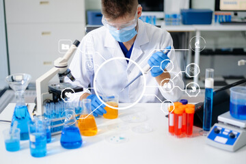 male scientist working with micro pipettes analyzing biochemical samples, advanced science chemical...