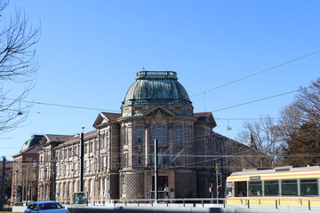 Yellow tram ariving in front of the Administration building town hall west in Renaissance Revival...