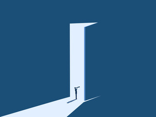 Businessman looking for opportunities at the big open door to welcome