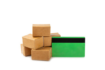 Online shopping concept.Cardboard box and shopping bags in a trolley isolated on white background. Shopping basket. Online shopping using a laptop, tablet, phone and credit card. Home delivery.