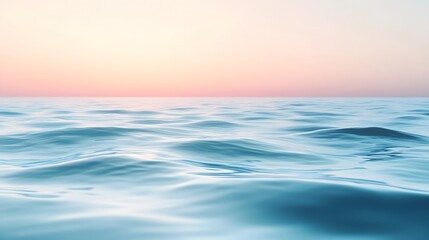 Obraz premium Serene ocean waves at dawn, calming blue waters with soft pastel skies, ideal for relaxation themes and tranquil backgrounds.