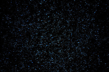 Black granite slabs with blue glow of crystals
